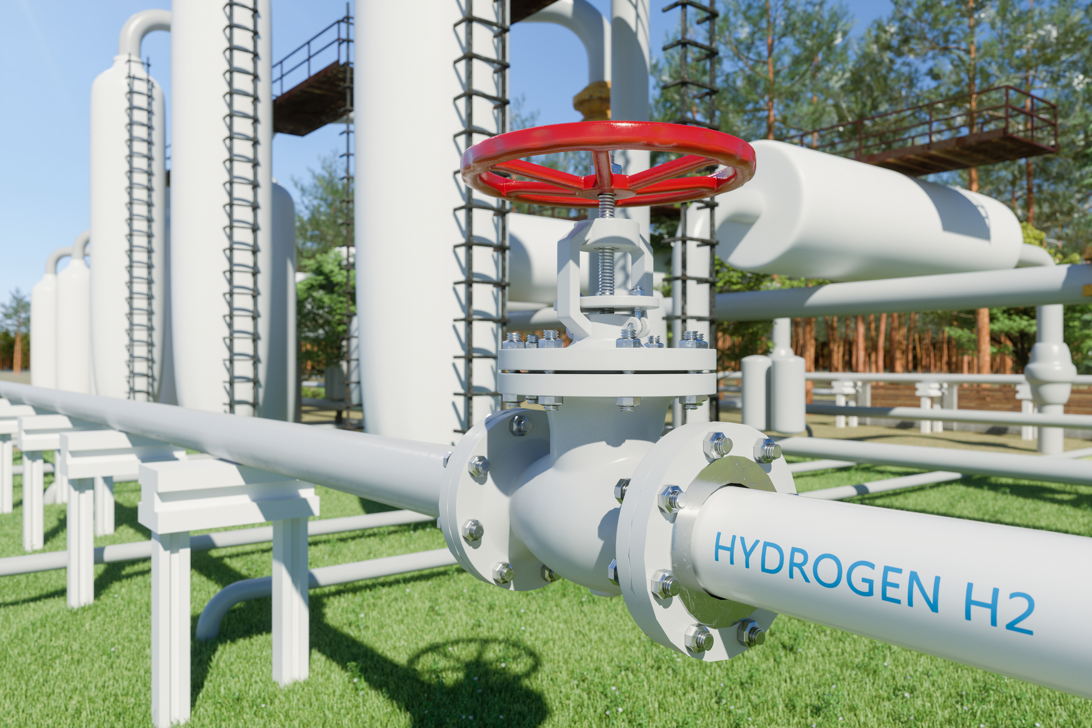 White pipes with a red release valve with 'Hydrogen H2' written on the side of a pipe.