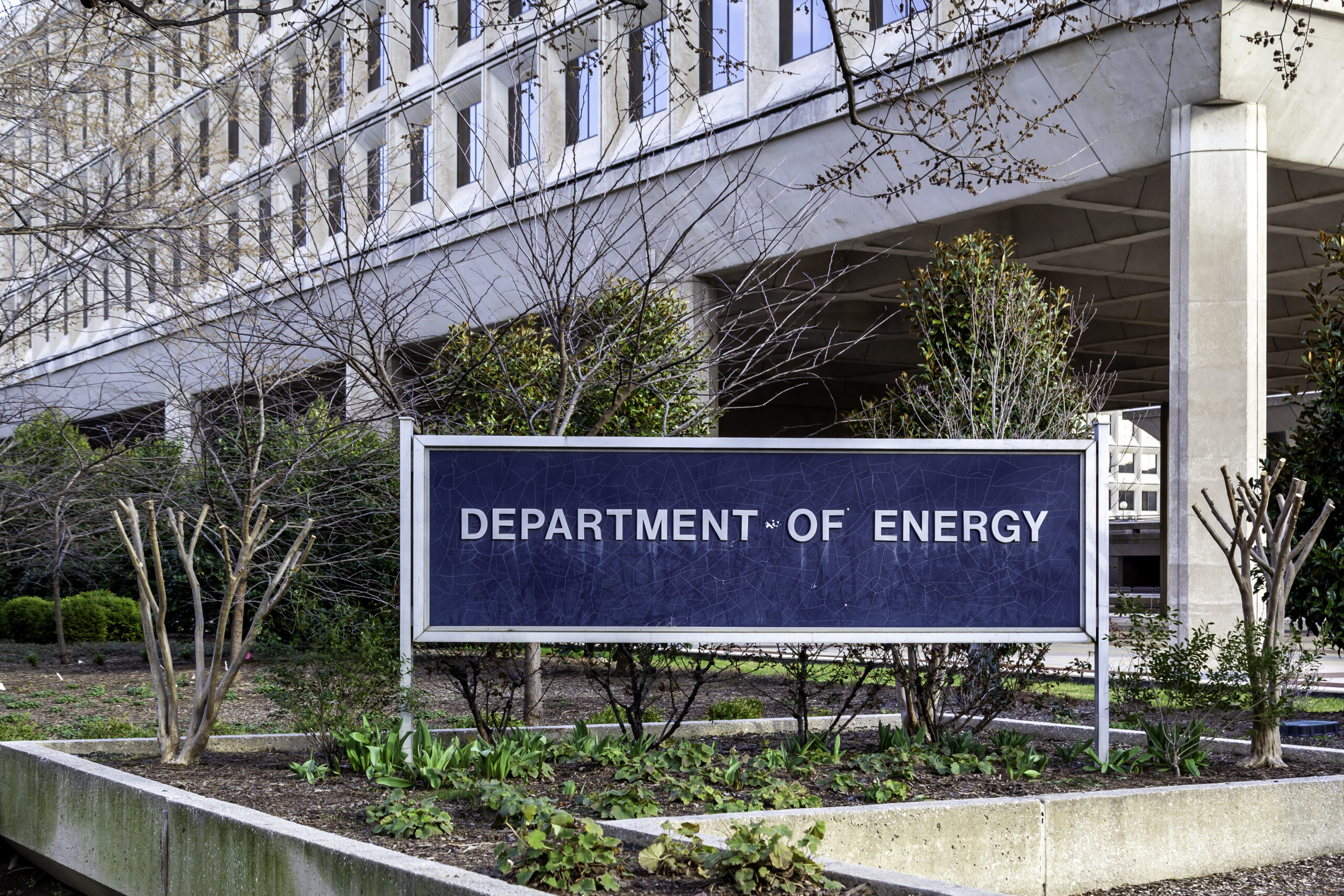 A photo of the Department of Energy sign outside the headquarters in Washington D.C. 